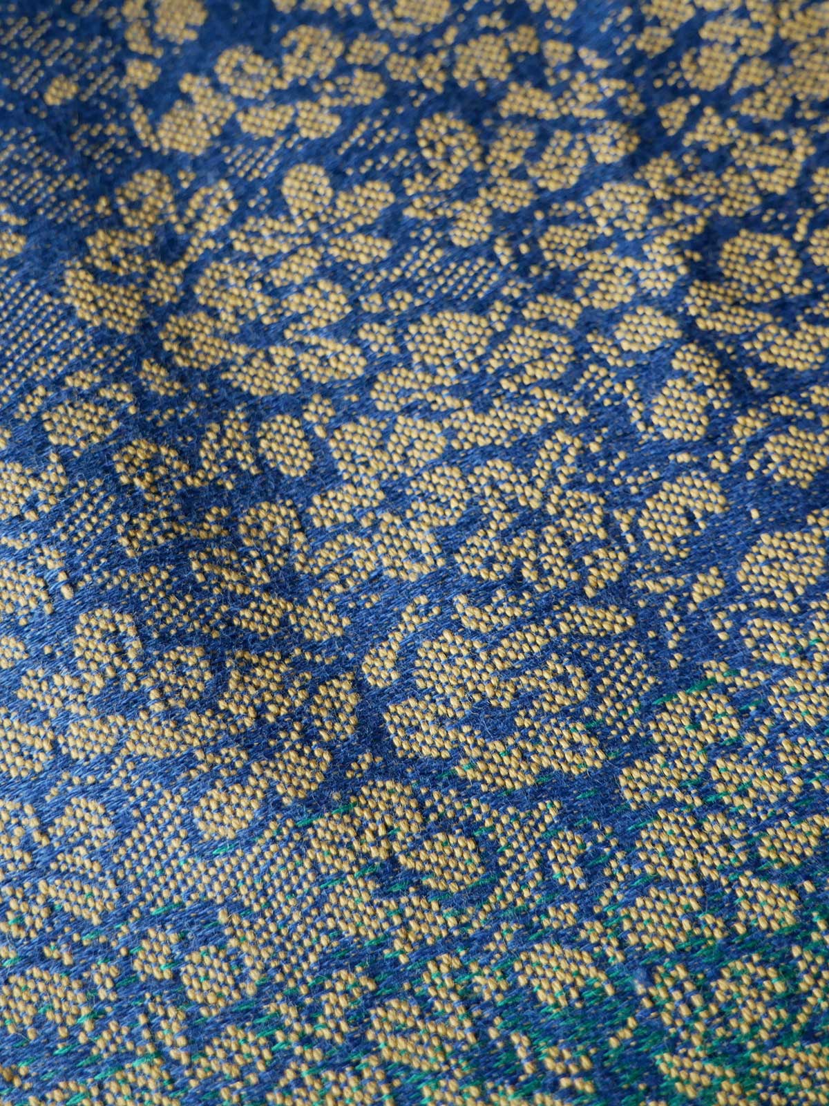 Close-up of blue fabric with a subtle pattern