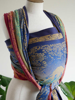 Colourful fabric wrap on a mannequin against a white background