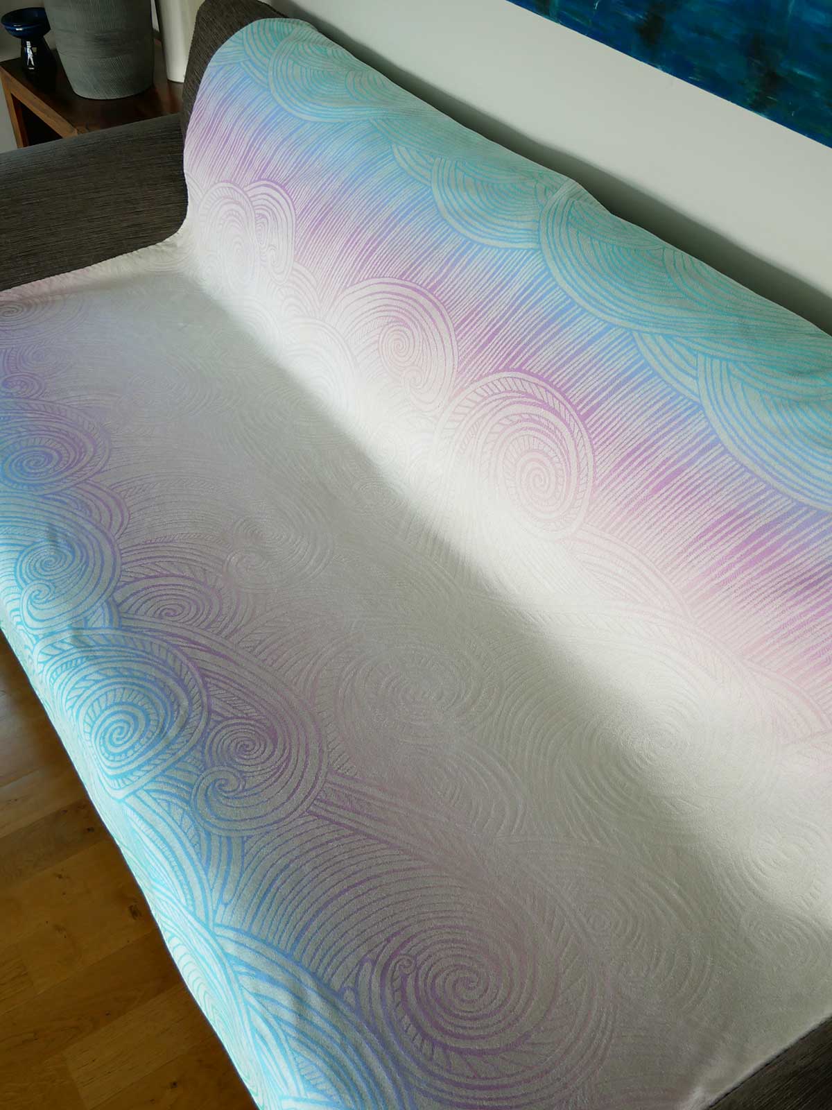 Textured blanket with wavy pattern on a surface.