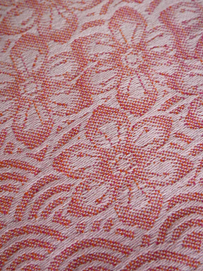 Close-up of a textured fabric with floral pattern