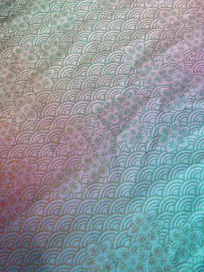 Multicolored fabric with a pattern of curved lines and floral elements