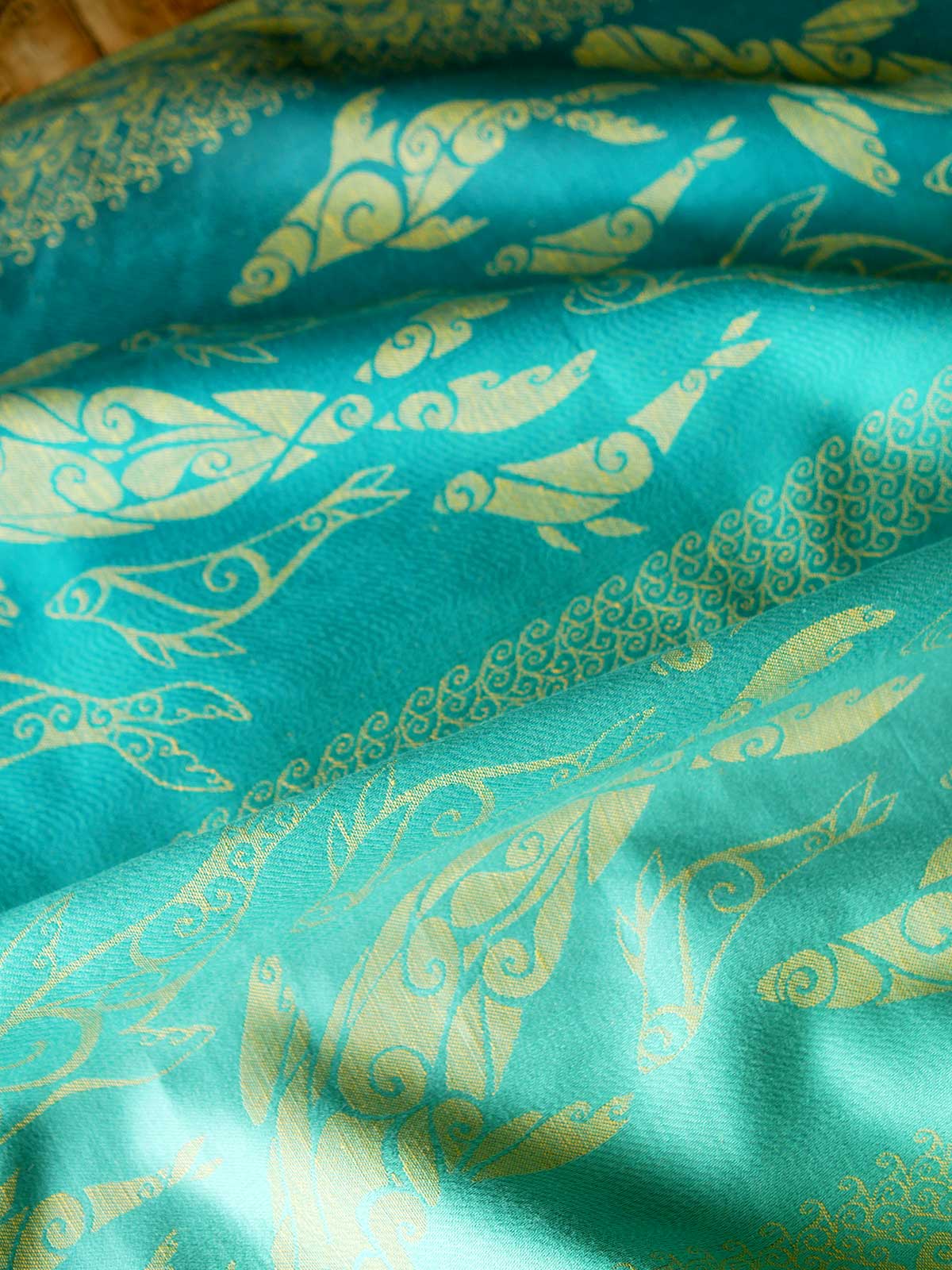 Teal fabric with gold selkies