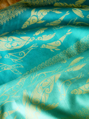 Teal fabric with gold selkies