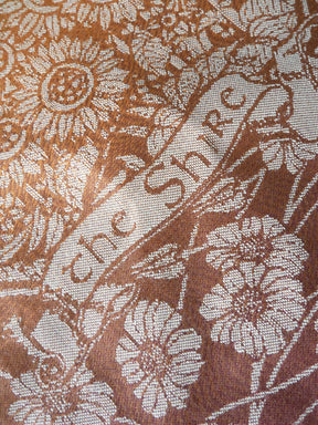 Floral patterned fabric with 'the Shire' branding.