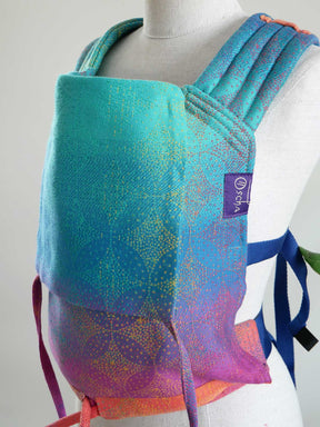 Colorful backpack with a brand label on a mannequin against a neutral background