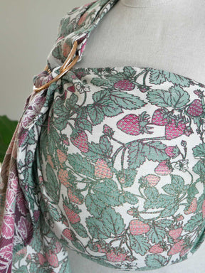 Strawberry patterned ring sling on a mannequin with a neutral background