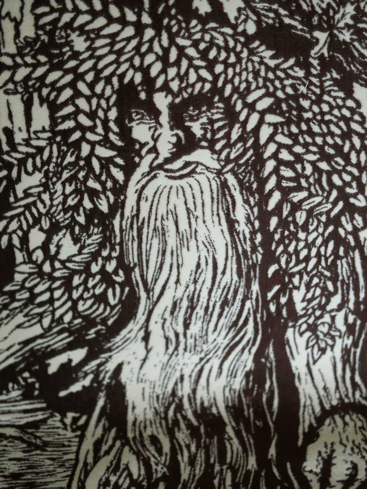 Close up of a brown throw with Treebeard design