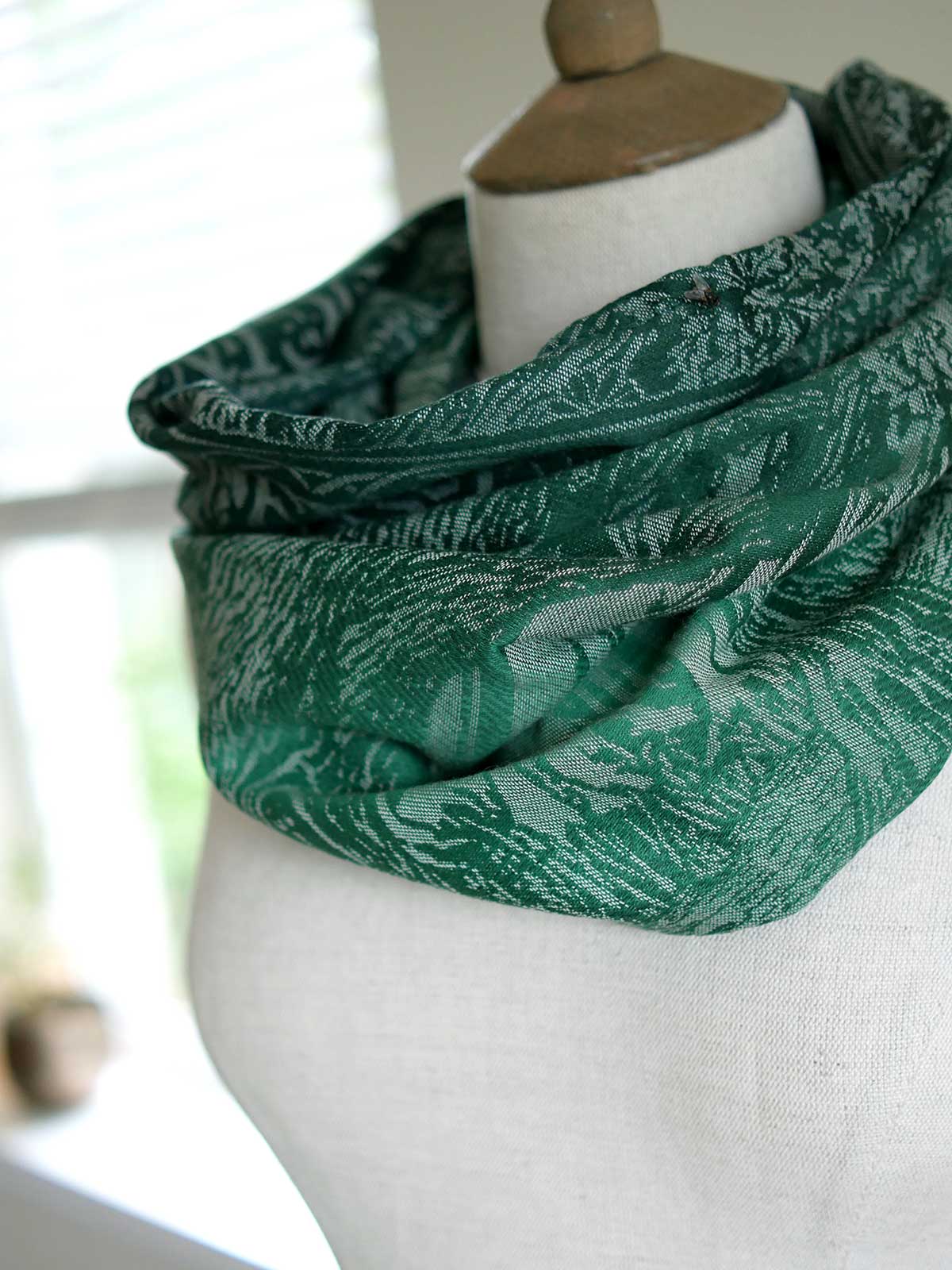 Side view of green cowl showing details of the design. 