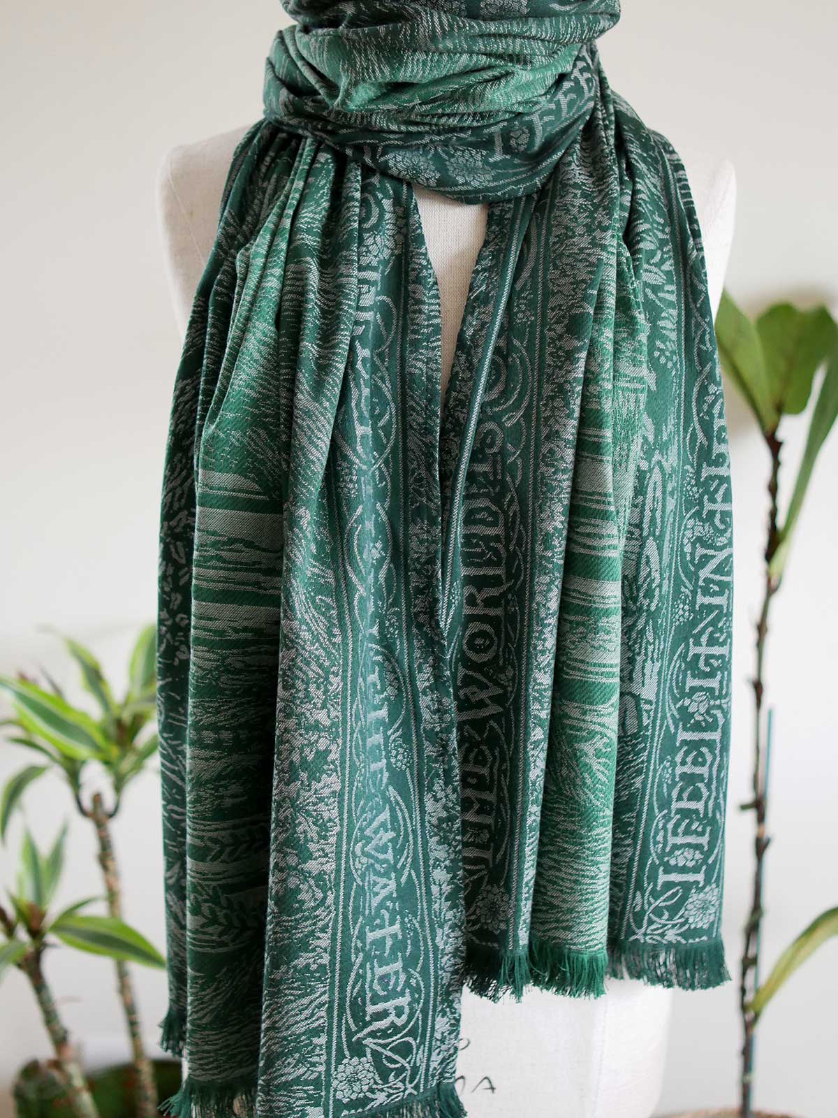 Green scarf with fringe and a The Lord of the Rings inspired 'Treebeard' design. 