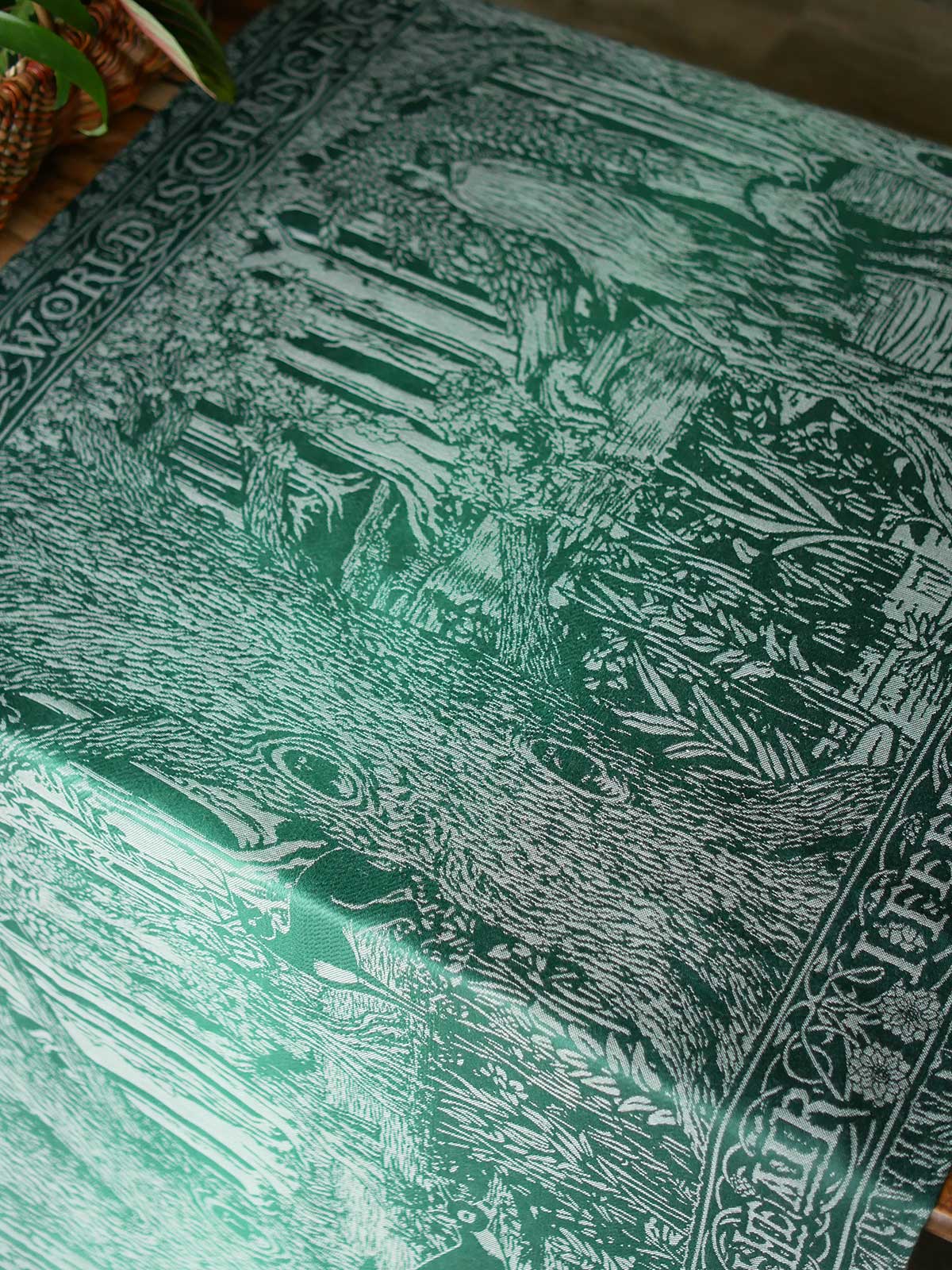 View of the fabric laid flat to show design, drape and shine. 