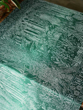View of the fabric laid flat to show design, drape and shine. 