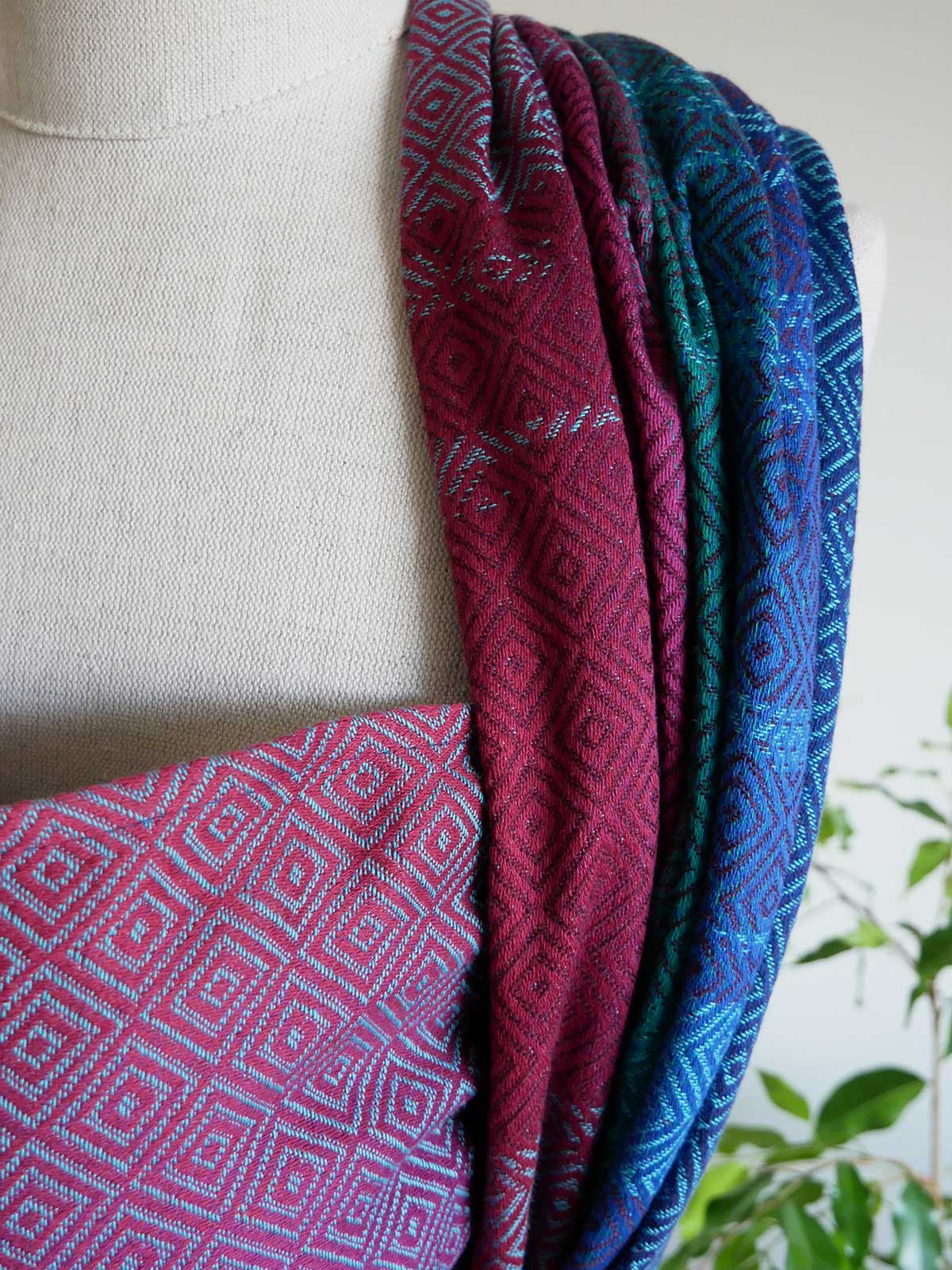 Close up of a jewel coloured patterned fabric on a mannequin 