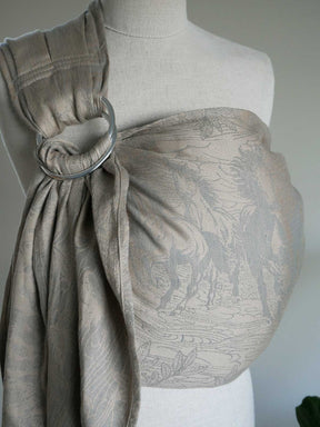Textured beige ring sling on a mannequin against a neutral background