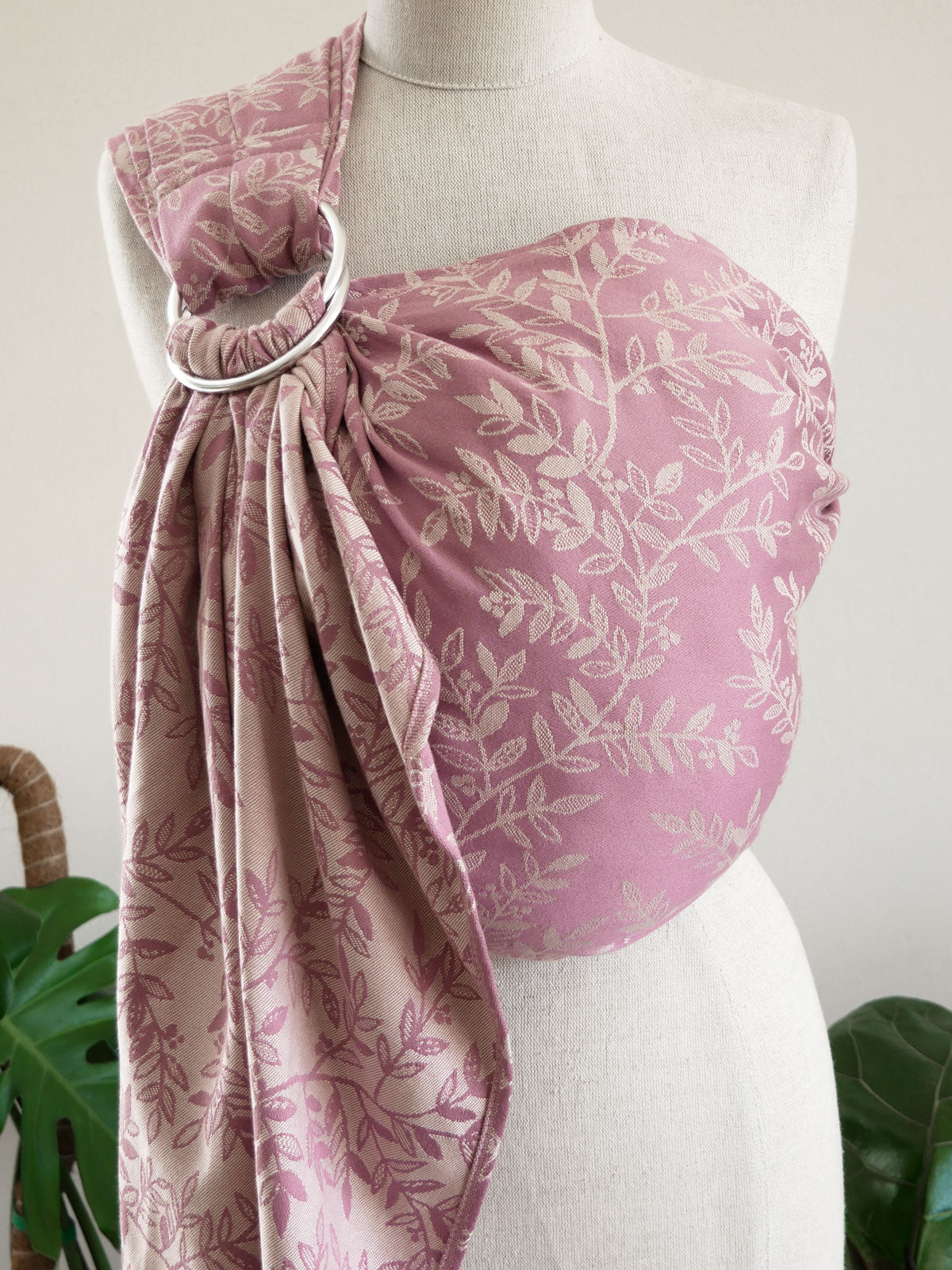 Pink floral ring sling on a mannequin with a white background