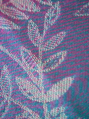 Close-up of a fabric with a pink and blue plaid pattern