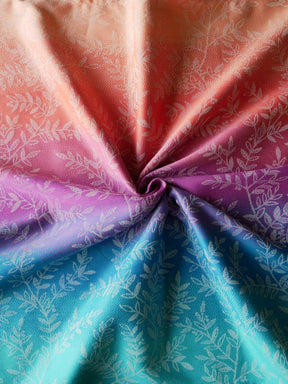 Close-up of fabric with a floral pattern in pink, purple, and blue.