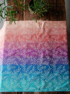Gradient fabric with leaf pattern on a wooden surface