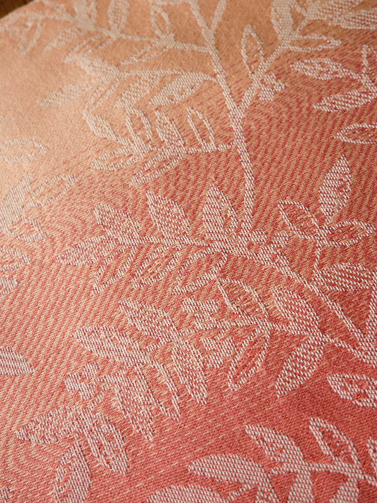 Close-up of pink fabric with a subtle pattern