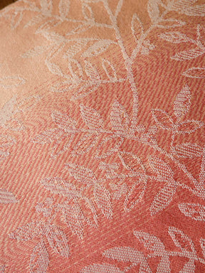 Close-up of pink fabric with a subtle pattern