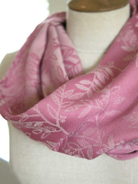 Close up of Pink fabric with a willow leaf pattern