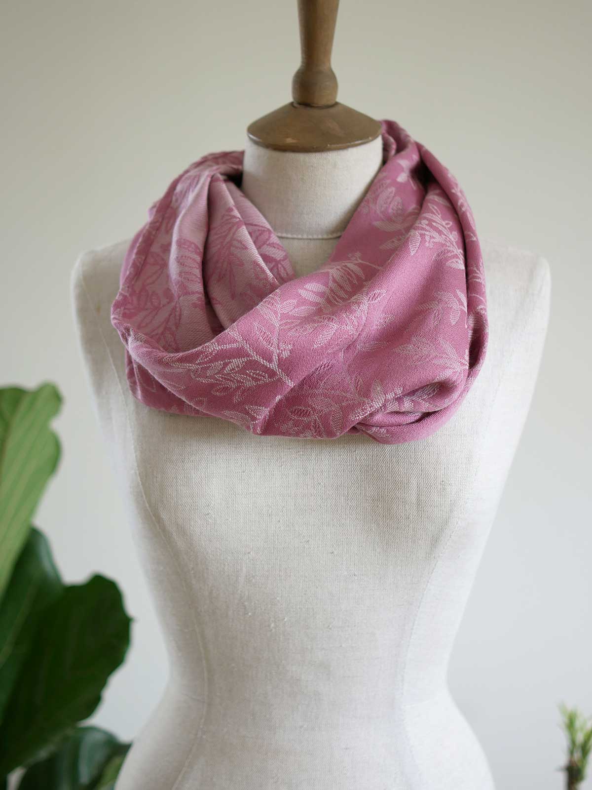 Pink cowl with a willow leaf pattern on a mannequin