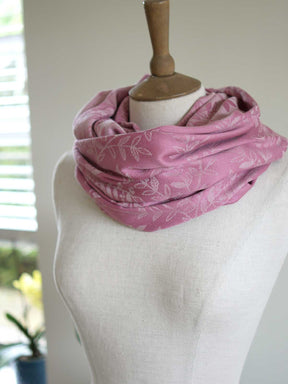 Pink infinity loop with a willow leaf pattern on a mannequin