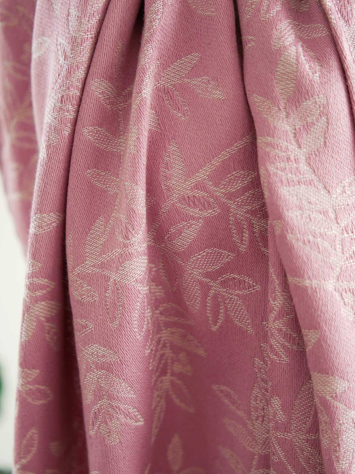 Close up of Pink fabric with a willow leaf pattern