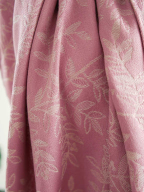 Close up of Pink fabric with a willow leaf pattern
