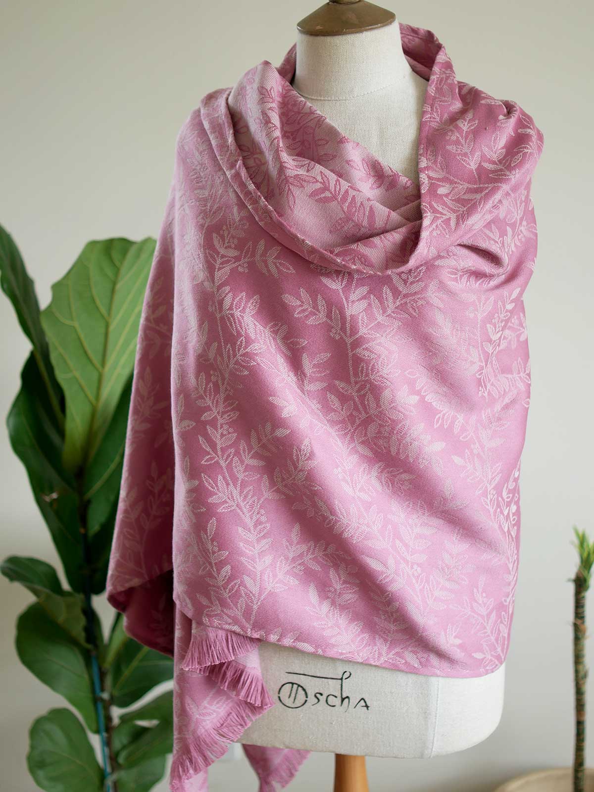 Pink scarf with a willow leaf pattern on a mannequin