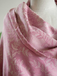 Close up of Pink fabric with a willow leaf pattern