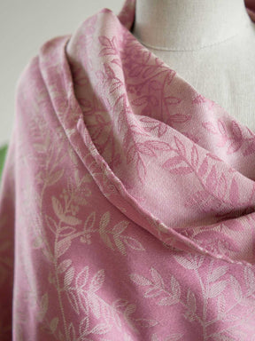 Close up of Pink fabric with a willow leaf pattern