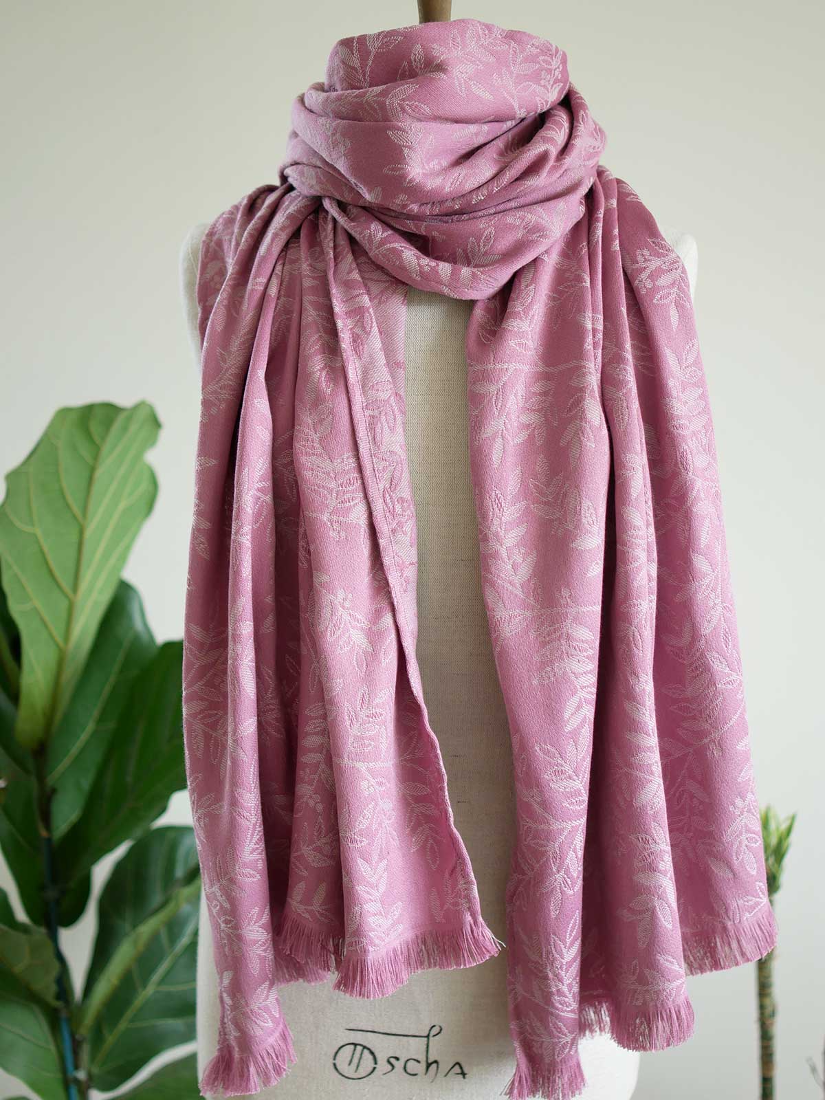 Pink scarf with a willow leaf pattern on a mannequin