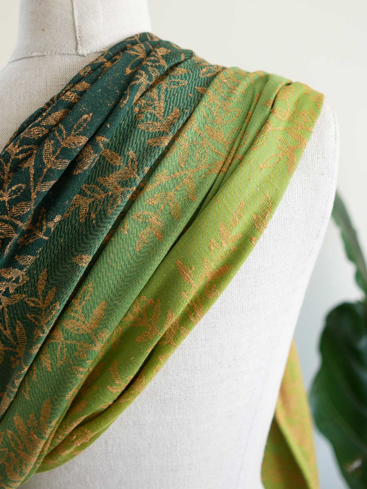Green fabric with gold leaf pattern 