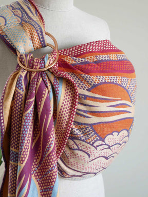 Colorful ring sling on a mannequin with a plain background