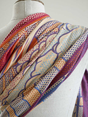 Colorful ring sling on a mannequin against a white background