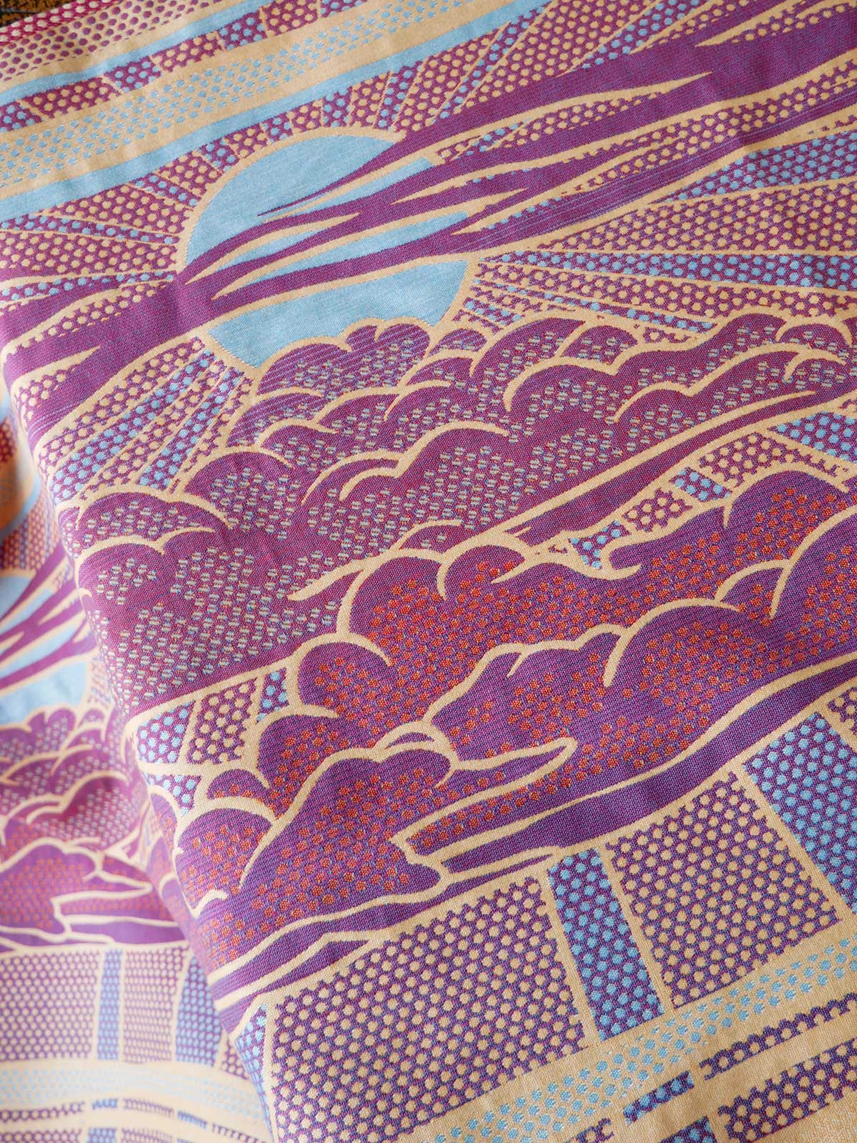 Reverse of a fabric with a purple and red pattern