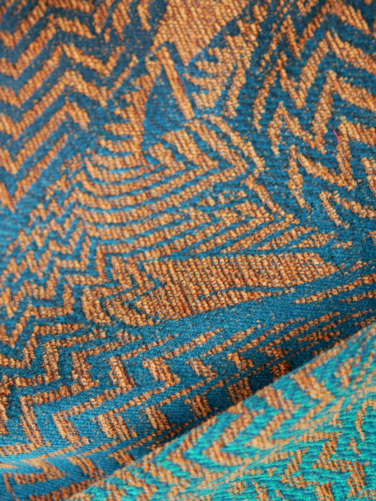 Close up of fox pattern on cotton and chenille baby wrap fabric. 