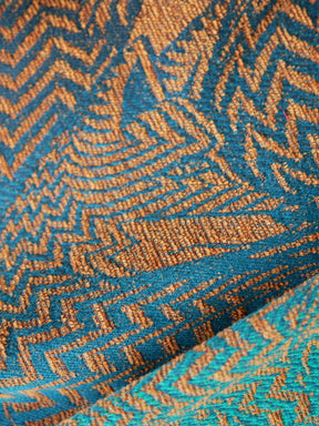 Close up of fox pattern on cotton and chenille baby wrap fabric. 
