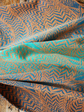 View of cotton and chenille baby wrap fabric.