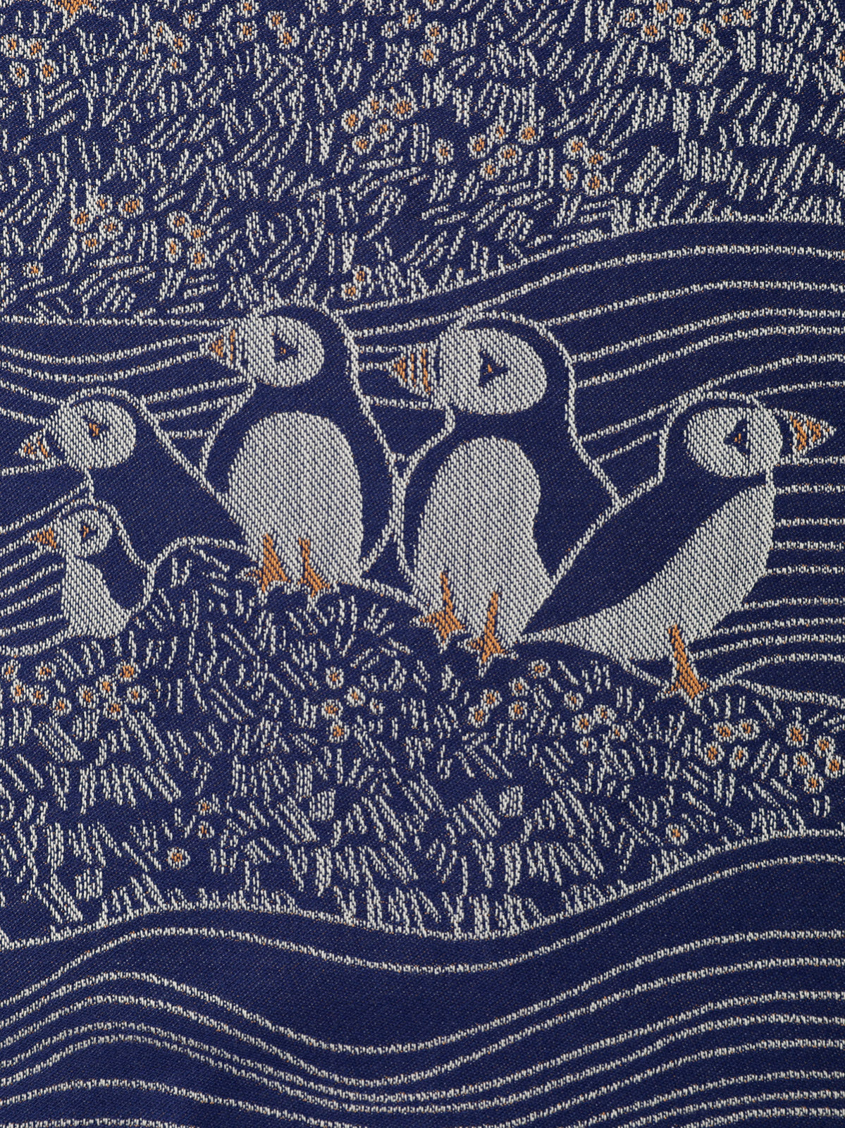 woven puffins bird textile in blue orange and white