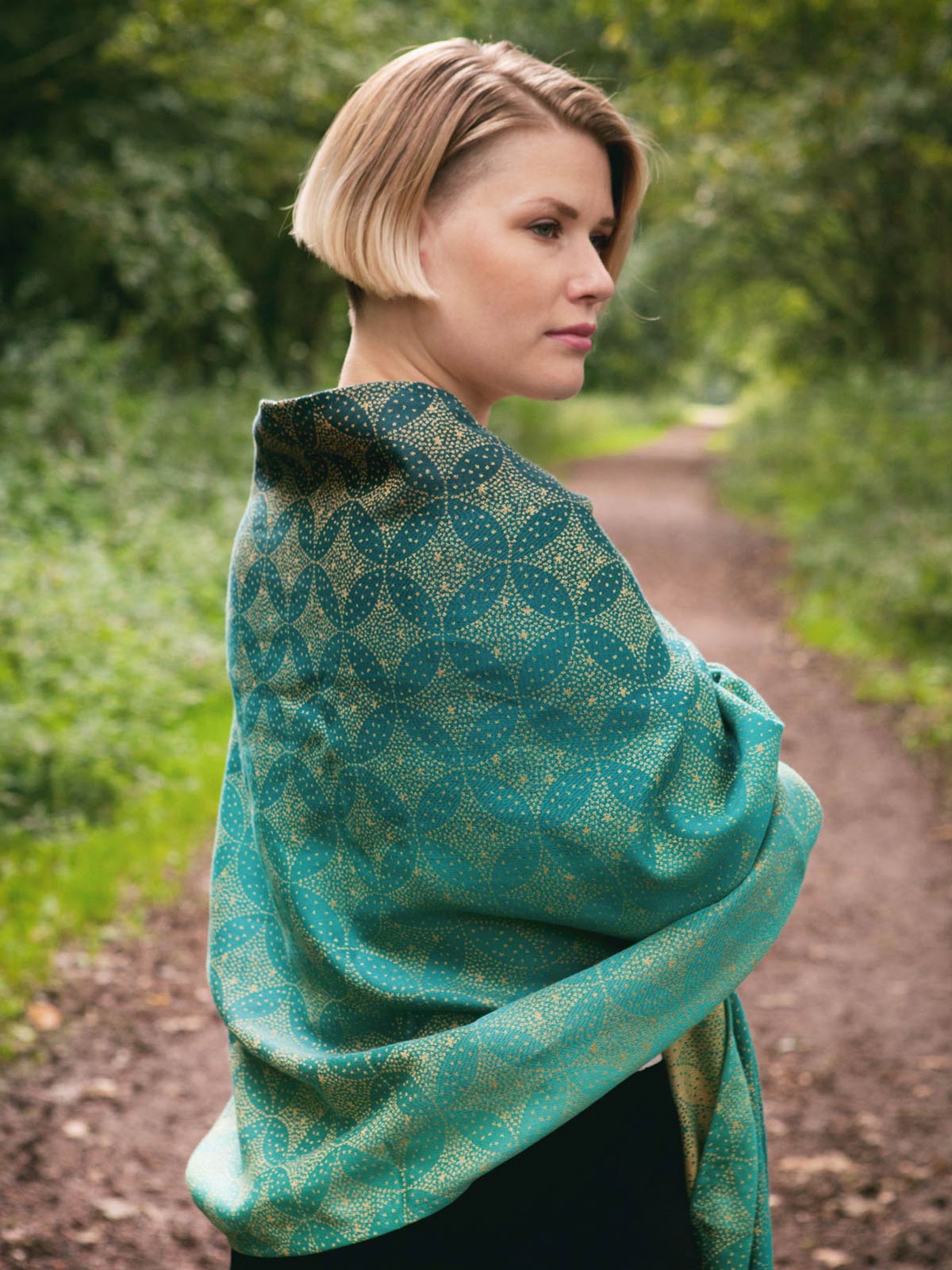 Oscha Slings - Scarf: £56.00 Infinity Loop: £33.00 Cowl: £45.00 Shimmery  and soft this 100% Tencel Ceò features our Evenstar pattern woven in  gorgeously subtle silver tones. 100% Tencel.